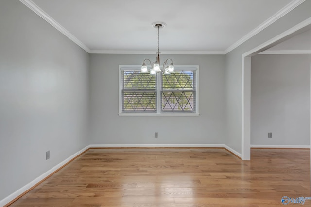 222 Lakewood Dr, Scottsboro, AL 35769 - unfurnished dining area with baseboards, ornamental molding, a chandelier, and light wood-style flooring