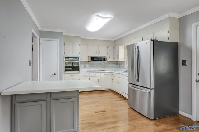 222 Lakewood Dr, Scottsboro, AL 35769 - kitchen with ornamental molding, appliances with stainless steel finishes, gray cabinetry, and light countertops