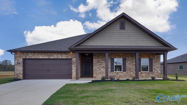 view of front of house with a garage and a front yard