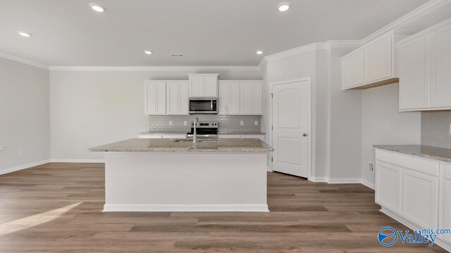 unfurnished living room featuring crown molding and dark wood-type flooring