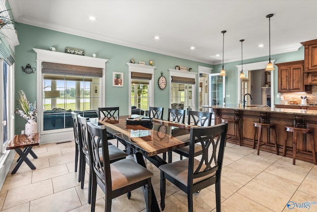 24051 Piney Creek Dr, Athens, AL 35613 - dining area with light tile patterned floors, ornamental molding, and recessed lighting
