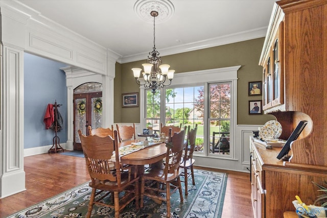 24051 Piney Creek Dr, Athens, AL 35613 - dining space with an inviting chandelier, crown molding, french doors, and wood finished floors