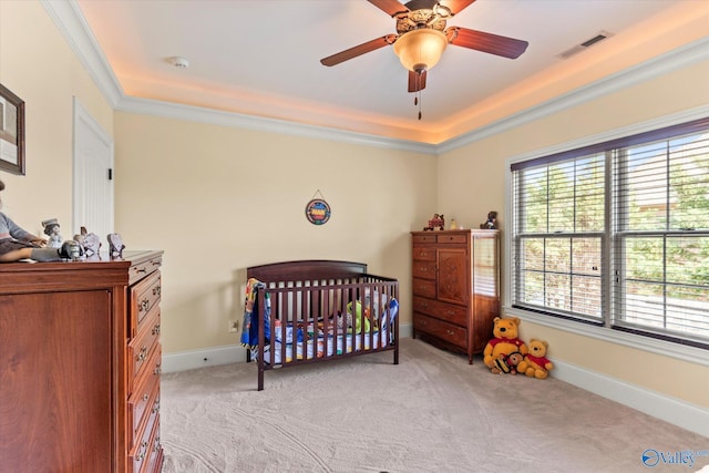 24051 Piney Creek Dr, Athens, AL 35613 - bedroom with light colored carpet, visible vents, a crib, baseboards, and a tray ceiling