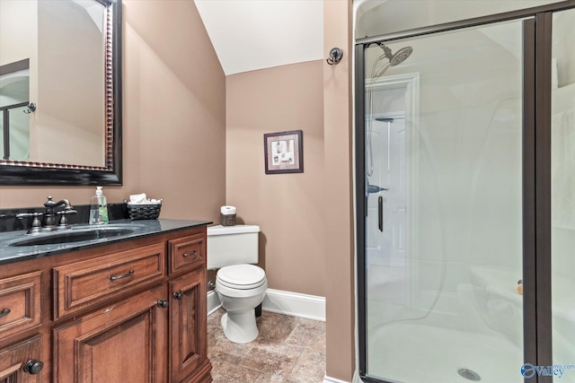24051 Piney Creek Dr, Athens, AL 35613 - full bathroom featuring vanity, toilet, baseboards, a shower stall, and lofted ceiling