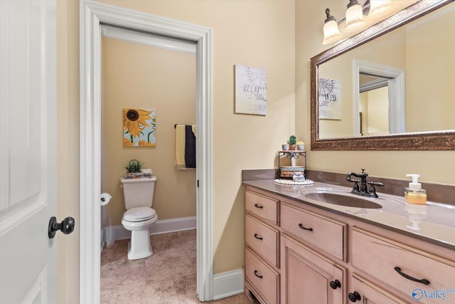24051 Piney Creek Dr, Athens, AL 35613 - bathroom featuring vanity, baseboards, tile patterned floors, and toilet