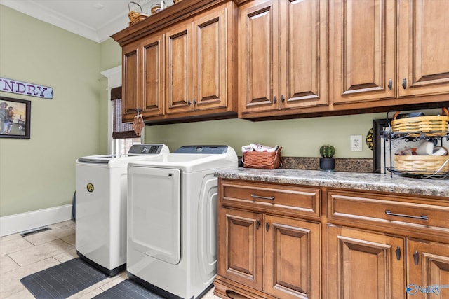24051 Piney Creek Dr, Athens, AL 35613 - laundry room with crown molding, visible vents, baseboards, separate washer and dryer, and cabinet space