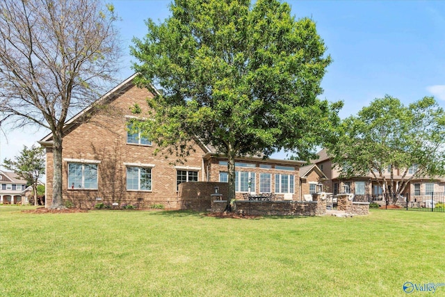 24051 Piney Creek Dr, Athens, AL 35613 - back of house featuring a lawn and brick siding