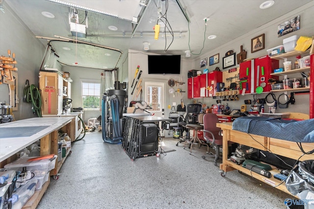 24051 Piney Creek Dr, Athens, AL 35613 - garage featuring a workshop area and a garage door opener