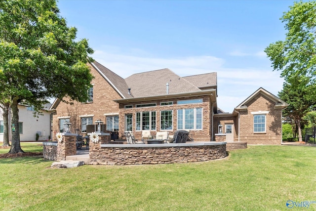 24051 Piney Creek Dr, Athens, AL 35613 - rear view of house with brick siding, a patio area, and a yard