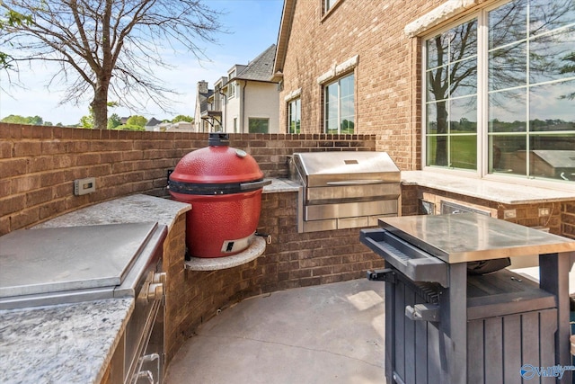 24051 Piney Creek Dr, Athens, AL 35613 - view of patio / terrace with a grill, fence, and an outdoor kitchen