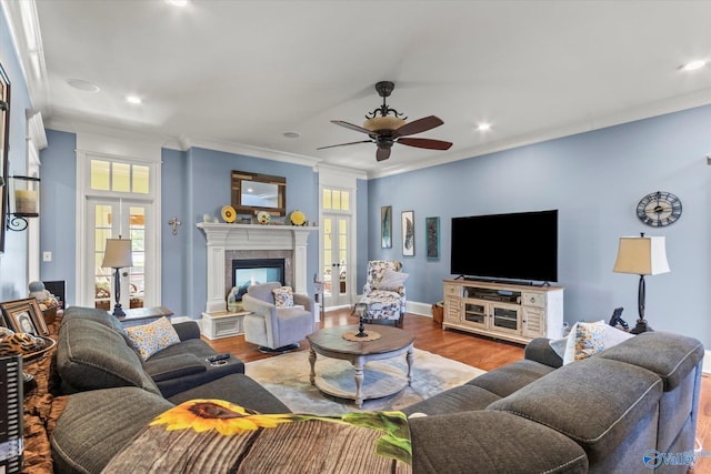 24051 Piney Creek Dr, Athens, AL 35613 - living area with crown molding, french doors, a ceiling fan, recessed lighting, and wood finished floors
