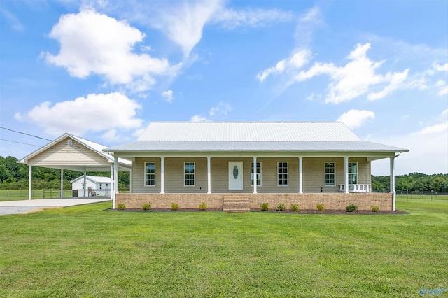 368 Halston Rd, Arab, AL 35016 - country-style home with covered porch, an attached carport, a front yard, an outbuilding, and driveway