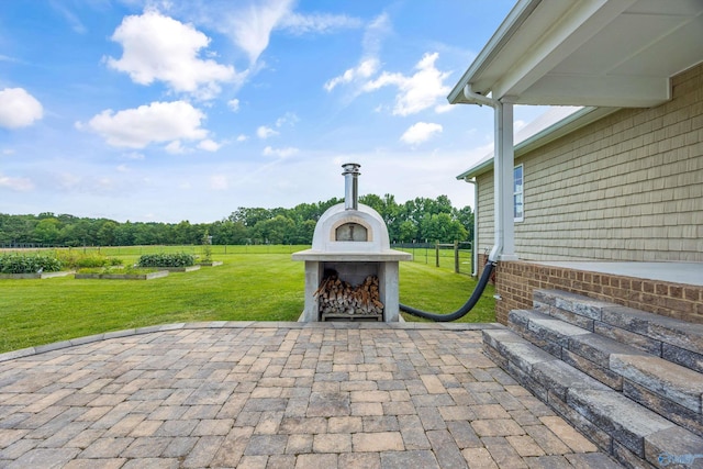 368 Halston Rd, Arab, AL 35016 - view of patio / terrace with exterior fireplace and view of scattered trees
