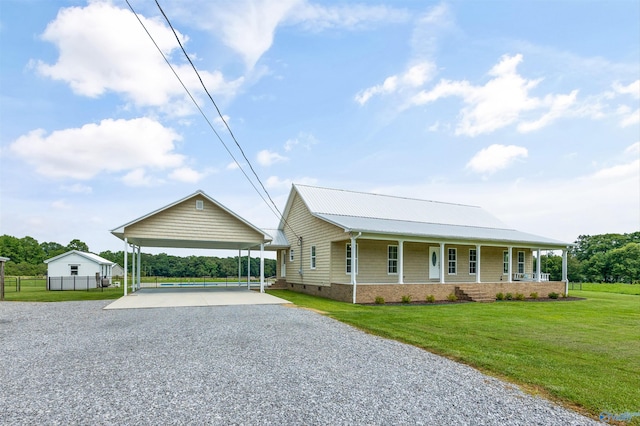 368 Halston Rd, Arab, AL 35016 - farmhouse inspired home with driveway, a porch, crawl space, a detached carport, and a metal roof