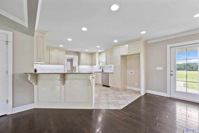 368 Halston Rd, Arab, AL 35016 - kitchen featuring dishwasher, cream cabinetry, a peninsula, light stone counters, and ornamental molding