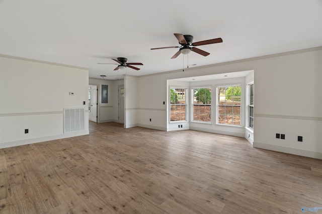 unfurnished living room featuring ornamental molding, light hardwood / wood-style flooring, and ceiling fan