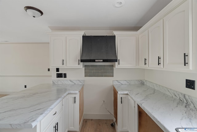 laundry area featuring light wood-type flooring