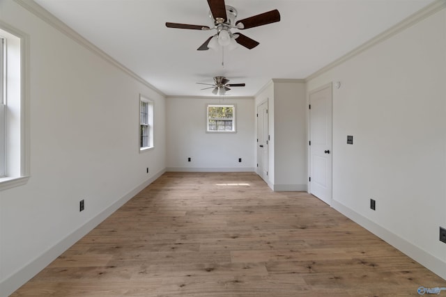 unfurnished room with light hardwood / wood-style floors, ceiling fan, and crown molding