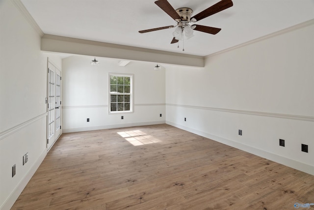 spare room featuring ceiling fan, light hardwood / wood-style floors, and crown molding