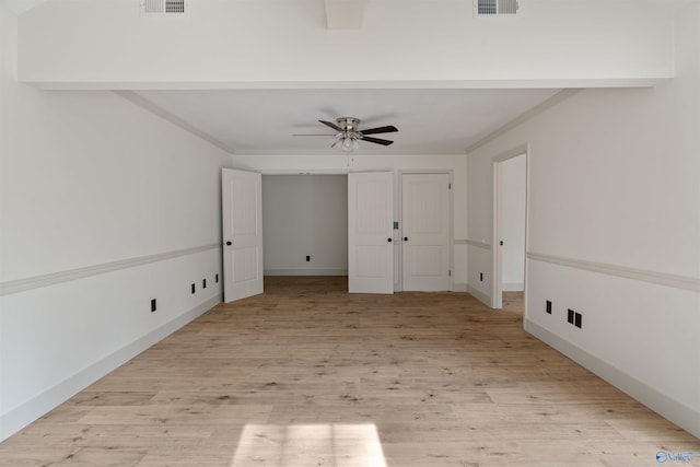 unfurnished room with light hardwood / wood-style floors, ceiling fan, and crown molding