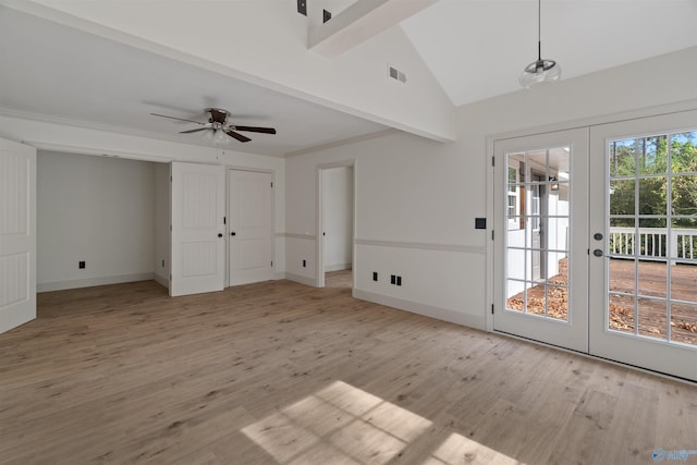 interior space featuring light wood-type flooring, french doors, ceiling fan, and beamed ceiling