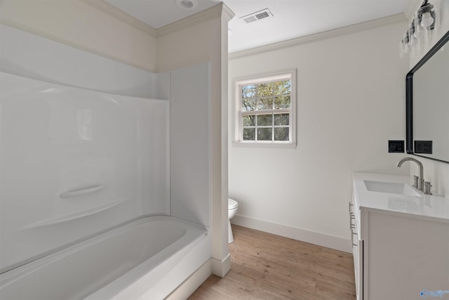 full bathroom with wood-type flooring, ornamental molding, vanity, shower / tub combination, and toilet