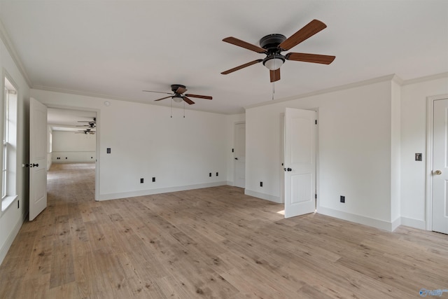 spare room with ornamental molding, a healthy amount of sunlight, light hardwood / wood-style floors, and ceiling fan