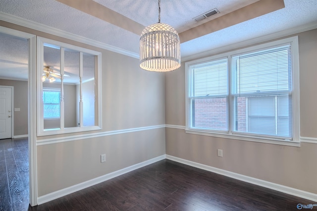 empty room featuring a textured ceiling, crown molding, dark hardwood / wood-style floors, and ceiling fan