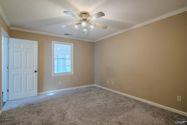 empty room with ornamental molding, a textured ceiling, carpet floors, and ceiling fan