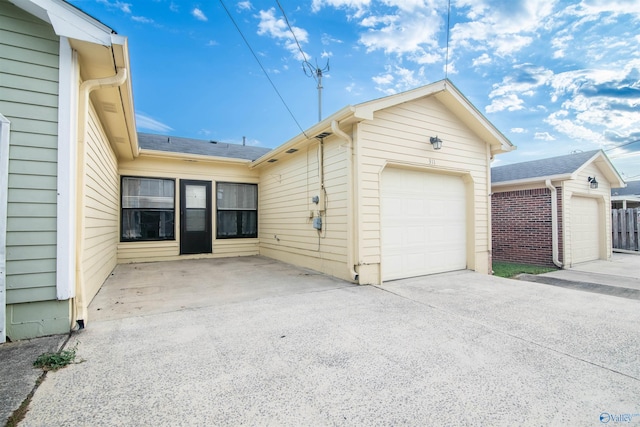 view of side of home featuring a garage