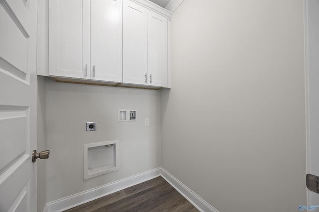 washroom with cabinet space, baseboards, dark wood-style flooring, hookup for a washing machine, and hookup for an electric dryer