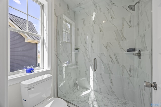 full bath featuring toilet and a marble finish shower