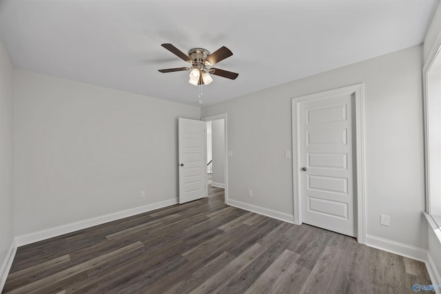 unfurnished bedroom featuring wood finished floors, a ceiling fan, and baseboards