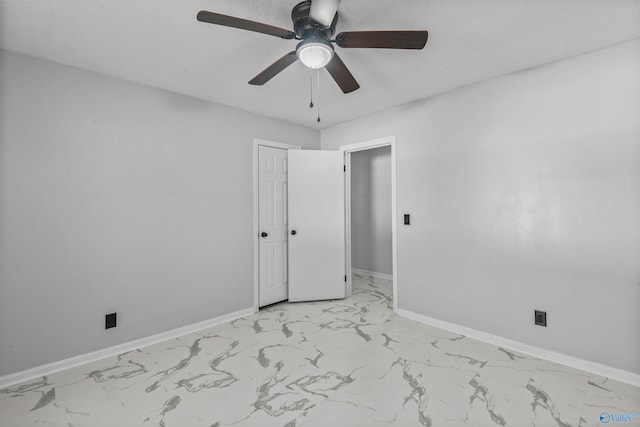 spare room with ceiling fan