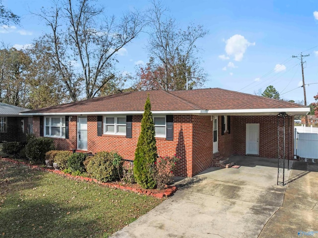 ranch-style house with a carport