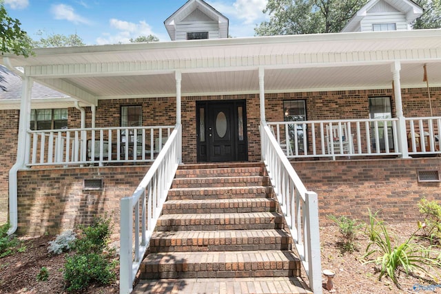 entrance to property featuring a porch