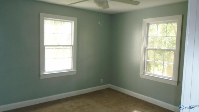 carpeted empty room with ceiling fan