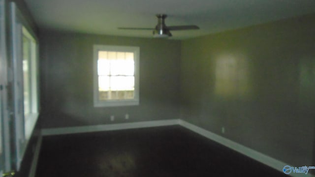 unfurnished room with ceiling fan