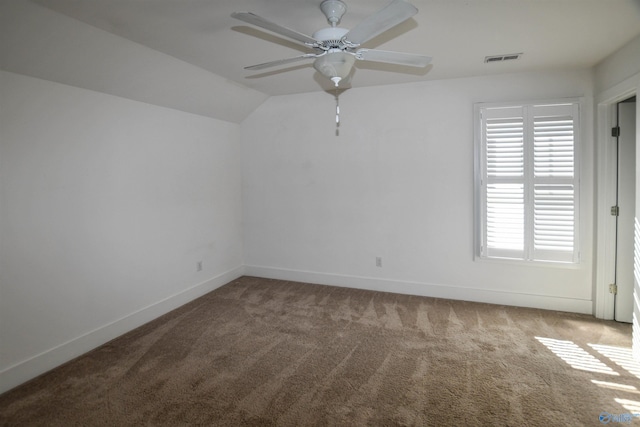 carpeted spare room with ceiling fan