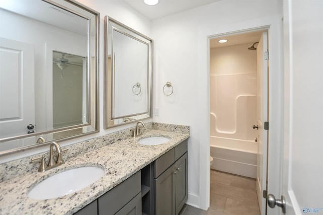 full bathroom with tile patterned floors, toilet, shower / tub combination, and vanity