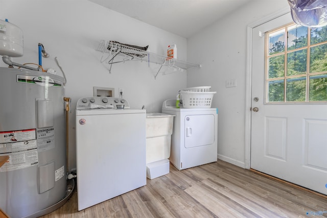 207 Sharp Dr, Gadsden, AL 35903 - laundry area featuring water heater, washing machine and dryer, and light wood-type flooring