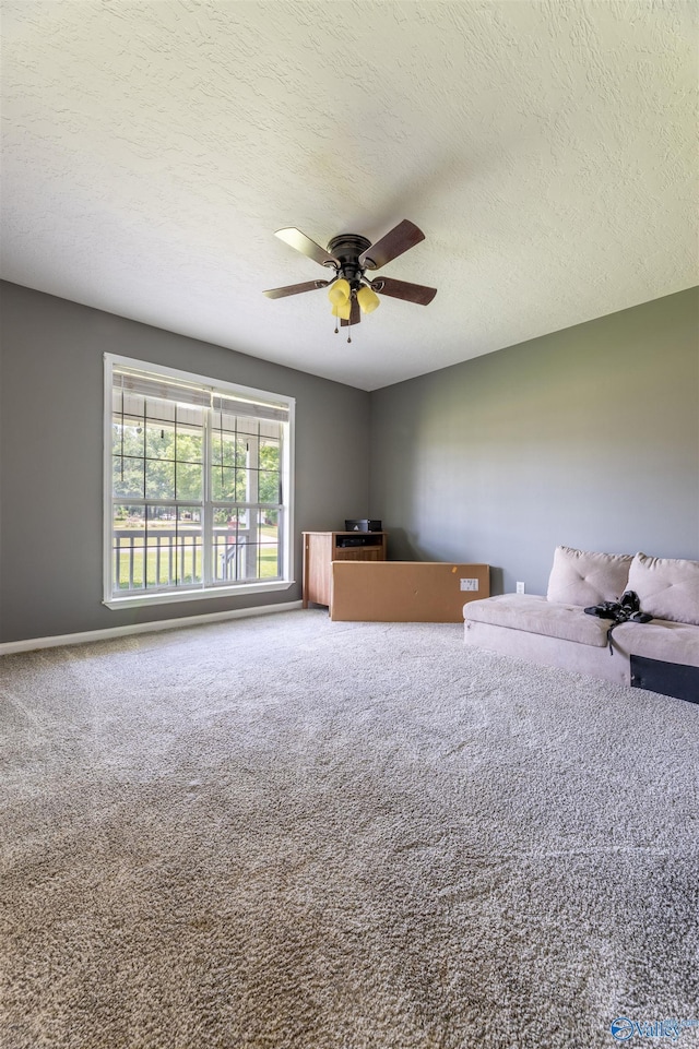 207 Sharp Dr, Gadsden, AL 35903 - carpeted bedroom featuring a textured ceiling and a ceiling fan