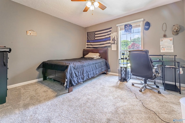207 Sharp Dr, Gadsden, AL 35903 - carpeted bedroom with baseboards, ceiling fan, and a desk