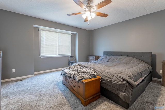 207 Sharp Dr, Gadsden, AL 35903 - bedroom featuring light colored carpet, baseboards, ceiling fan, and a textured ceiling