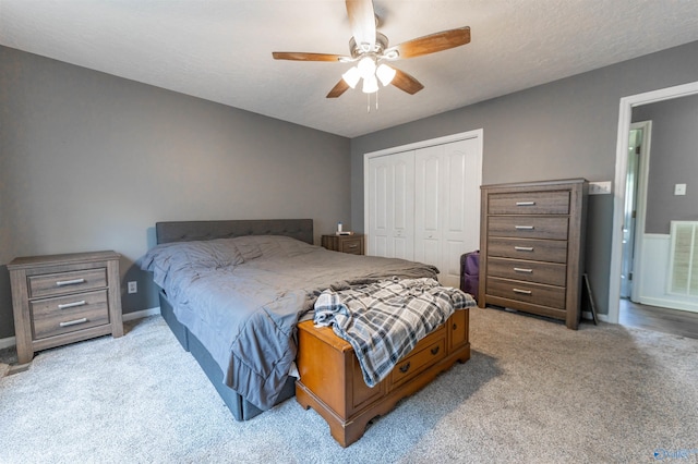 207 Sharp Dr, Gadsden, AL 35903 - bedroom with carpet, a closet, baseboards, and a ceiling fan