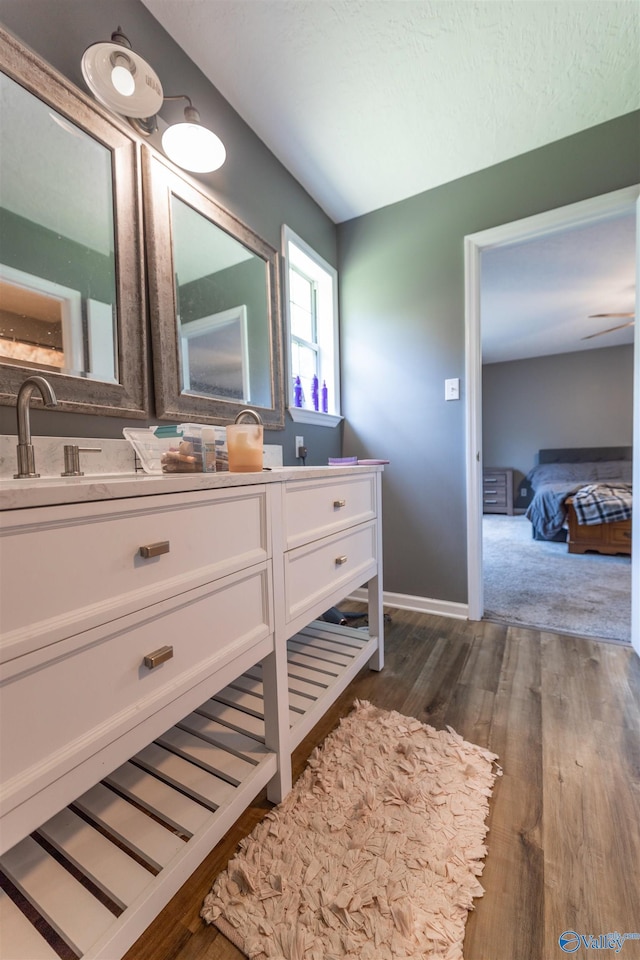 207 Sharp Dr, Gadsden, AL 35903 - bathroom with vanity, wood finished floors, and baseboards