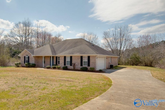 single story home featuring a garage, a front lawn, and central air condition unit