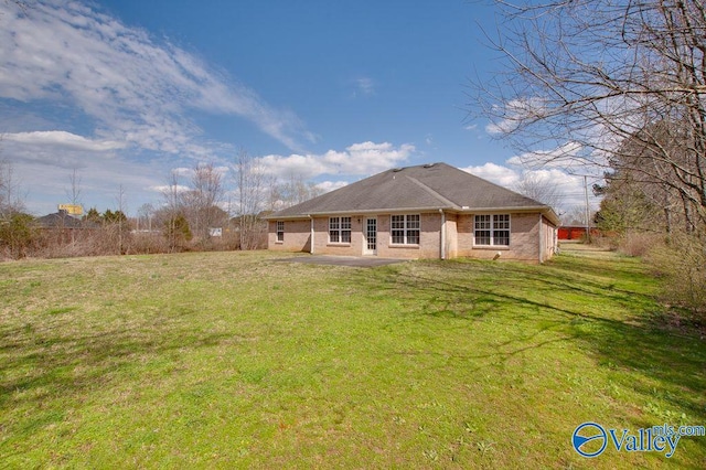 back of house with a yard