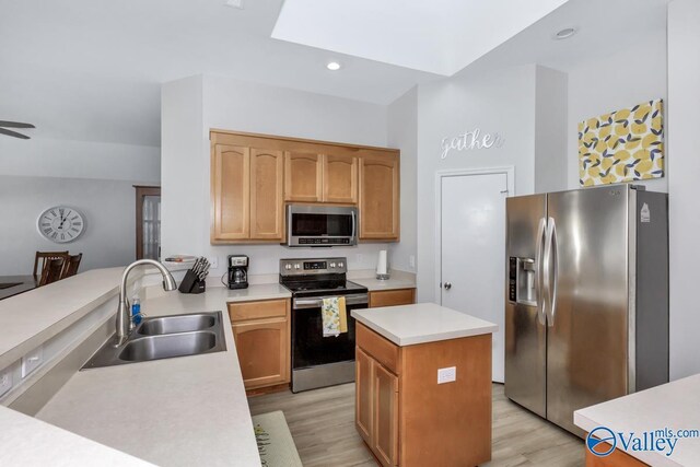 110 SW Cotton Bend Dr, Huntsville, AL 35824 - kitchen with stainless steel appliances, a sink, light countertops, light wood-style flooring, and recessed lighting