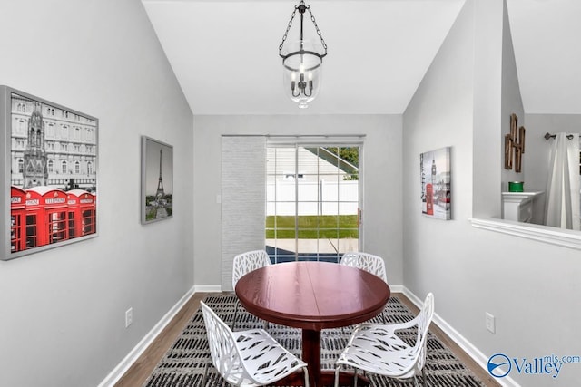 110 SW Cotton Bend Dr, Huntsville, AL 35824 - dining room featuring wood finished floors, baseboards, and lofted ceiling